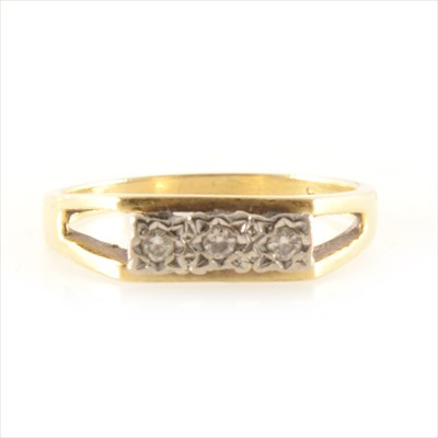 Lot 243 - A 1970s diamond three stone ring.