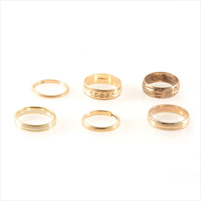 Lot 262 - Six 9 carat yellow and white gold wedding bands.