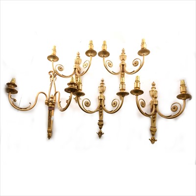 Lot 468 - Four modern gilt metal two-light wall brackets