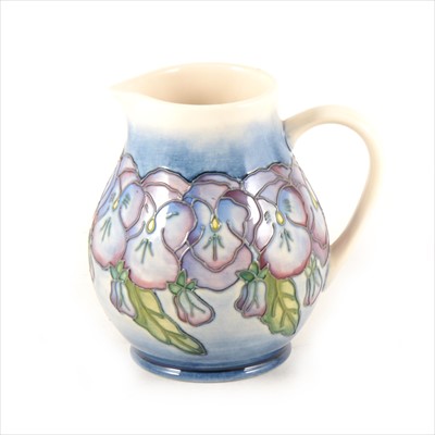 Lot 5 - A pottery jug decorated with Violas or Pansies, by Moorcroft Pottery