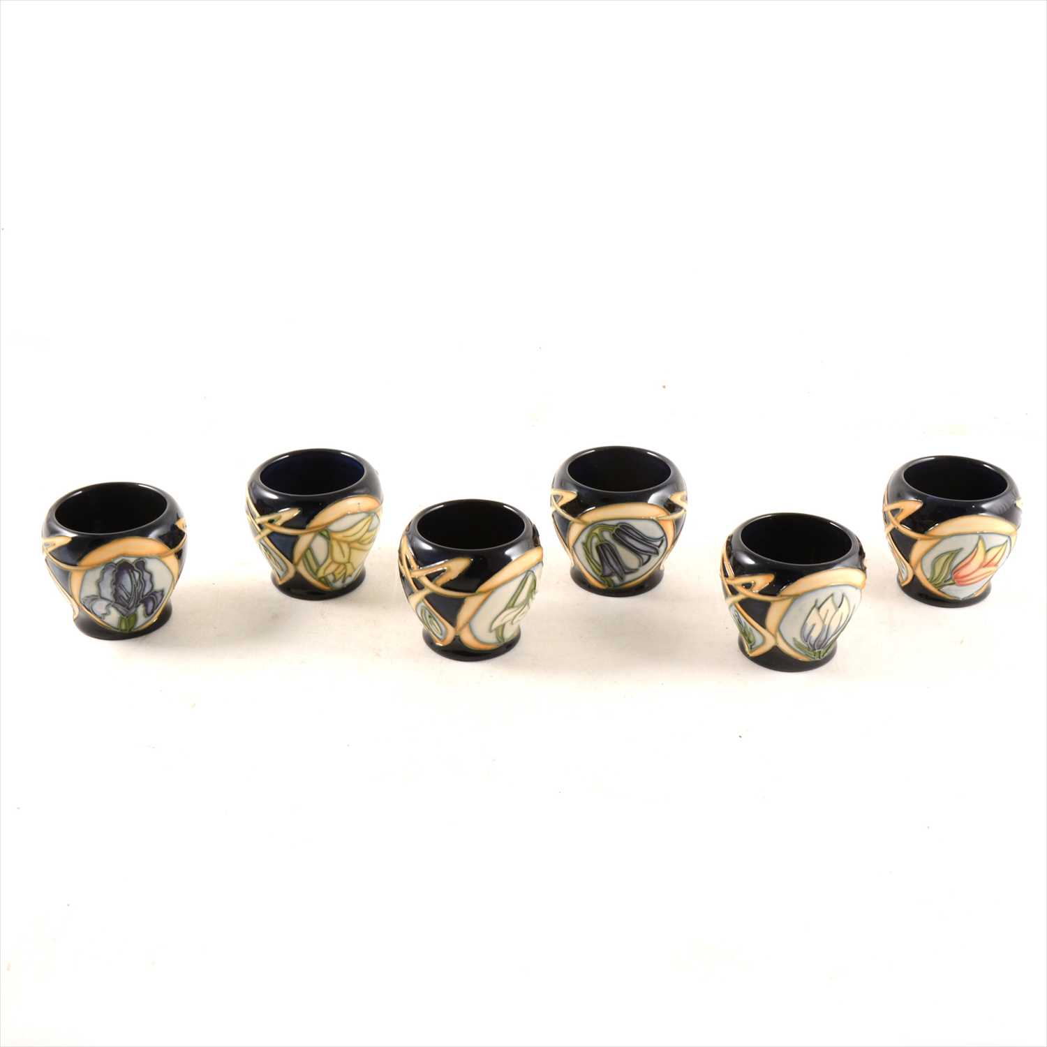 Lot 3 - A set of six egg cups, Parisian Dream, designed by Sian Leeper for Moorcroft Pottery, 2004.