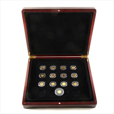 Lot 204 - Part set of gold miniature coins, 1/20oz, in a wooden case