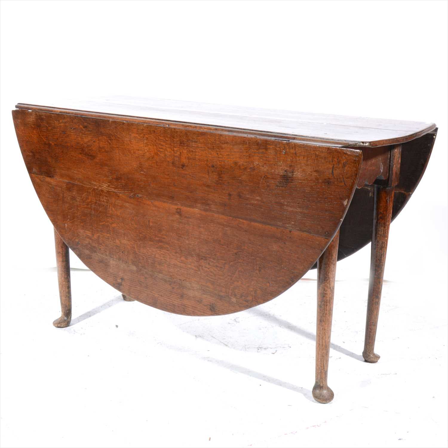 Lot 496 - A Georgian oak dropleaf table