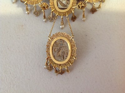 Lot 1332 - An unusual mid 19th Century Egyptian Revival yellow metal mounted ceramic scarab suite of jewellery.