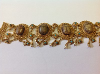 Lot 1332 - An unusual mid 19th Century Egyptian Revival yellow metal mounted ceramic scarab suite of jewellery.