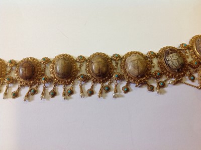 Lot 1332 - An unusual mid 19th Century Egyptian Revival yellow metal mounted ceramic scarab suite of jewellery.