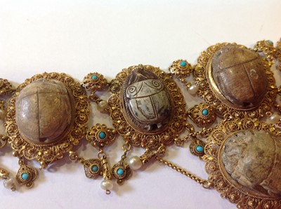 Lot 1332 - An unusual mid 19th Century Egyptian Revival yellow metal mounted ceramic scarab suite of jewellery.