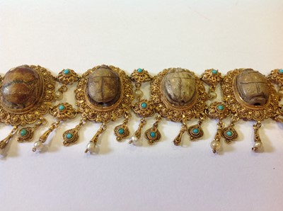 Lot 1332 - An unusual mid 19th Century Egyptian Revival yellow metal mounted ceramic scarab suite of jewellery.