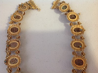 Lot 1332 - An unusual mid 19th Century Egyptian Revival yellow metal mounted ceramic scarab suite of jewellery.