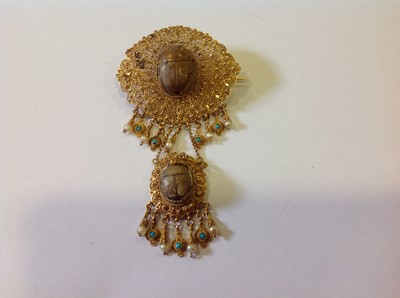 Lot 1332 - An unusual mid 19th Century Egyptian Revival yellow metal mounted ceramic scarab suite of jewellery.