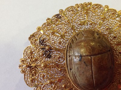 Lot 1332 - An unusual mid 19th Century Egyptian Revival yellow metal mounted ceramic scarab suite of jewellery.