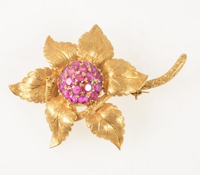 Lot 71 - An 18 carat yellow gold and ruby floral brooch.