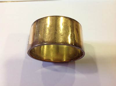 Lot 95 - A mid 19th Century yellow metal 33mm wide half hinged bangle