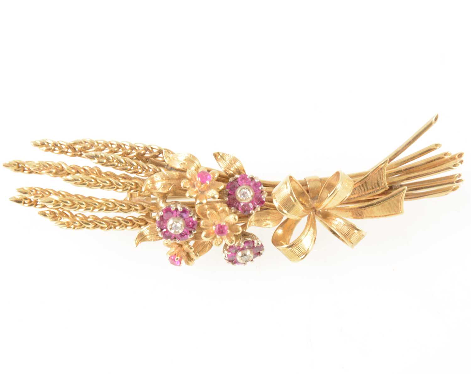 Lot 72 - An 18 carat gold ruby and diamond brooch, in the form of sheaf of corn.