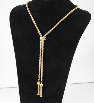 Lot 1325 - A 9 carat yellow and white gold necklace with tassel ends.