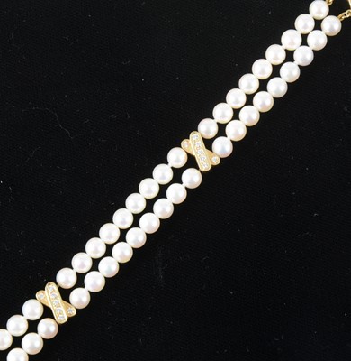 Lot 131 - Mikimoto - A two row cultured pearl bracelet.