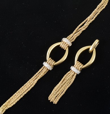 Lot 85 - An 18 carat yellow gold and diamond bracelet with matching pendant