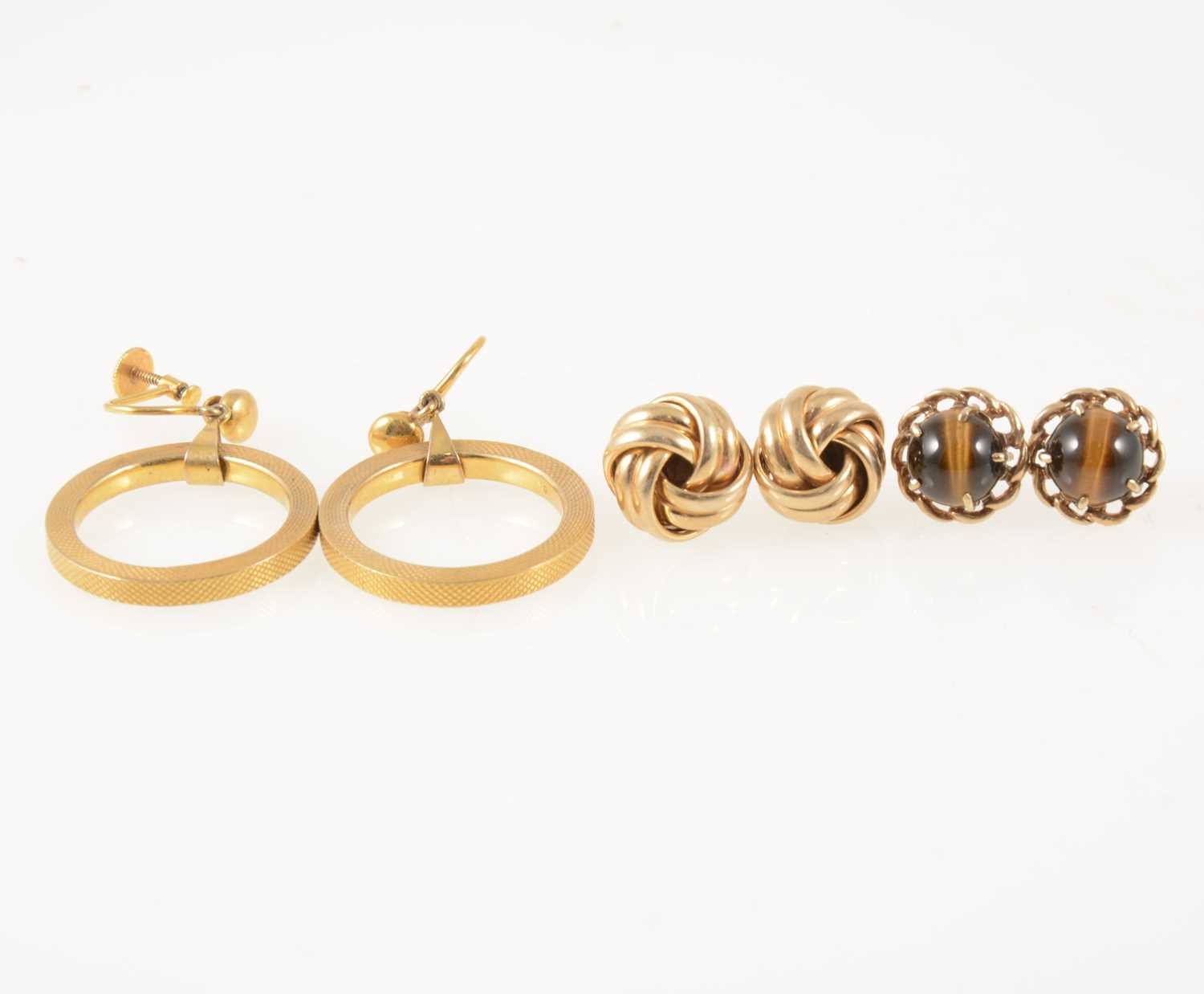 Lot 59 - Three pairs of gold earrings.