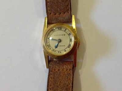 Lot 150 - Cartier - a lady's 18 carat yellow gold wrist watch.