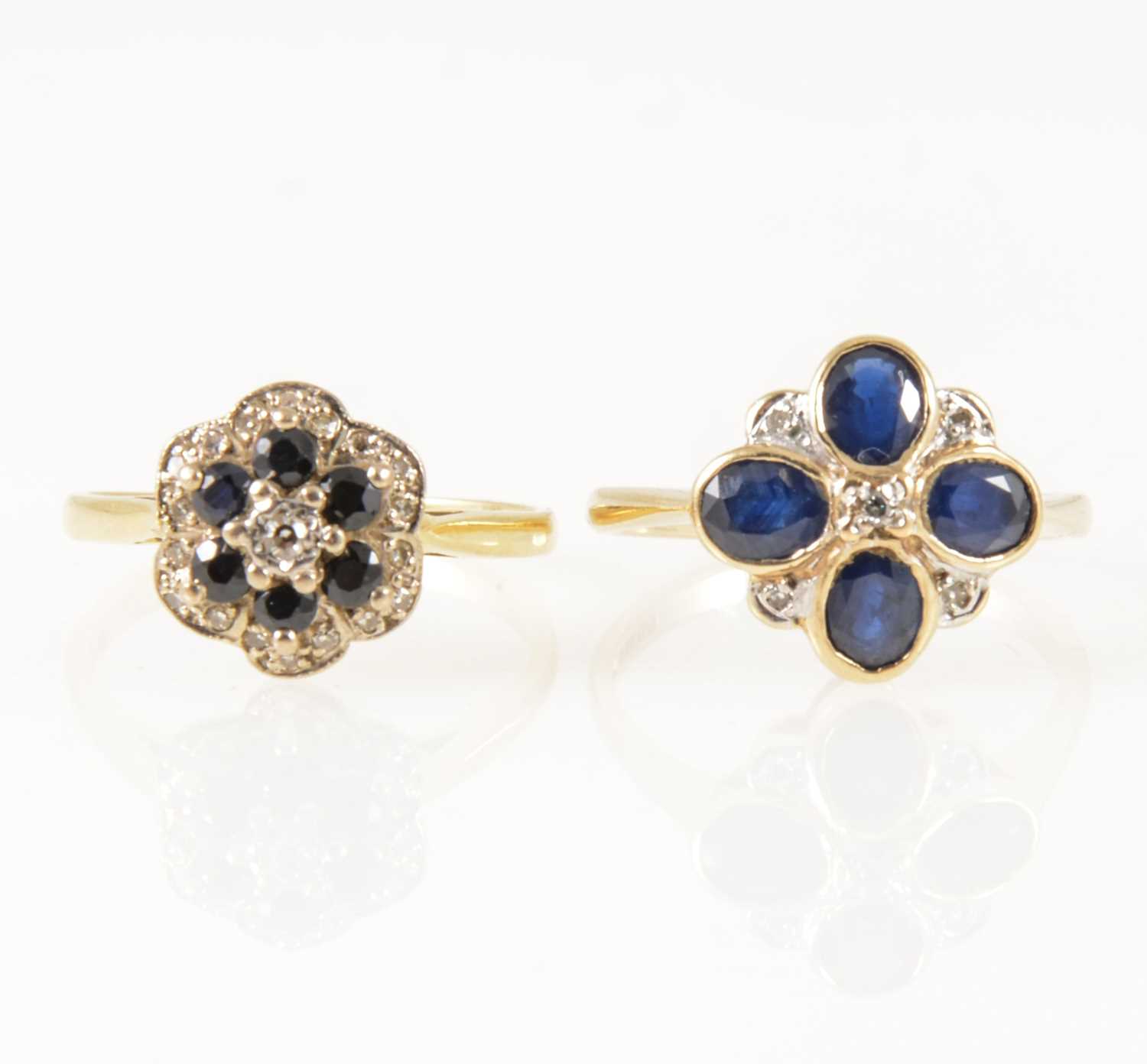 Lot 40 - Two sapphire and diamond circular cluster rings.