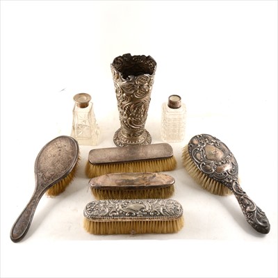 Lot 280 - A Victorian silver vase, William Comyns, London 1890, silver-backed brushes and silver-mounted scent bottles.