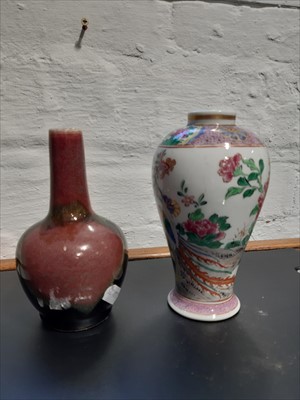 Lot 25 - An Arita style porcelain plate, a Chinese famille rose vase, and a high fired vase