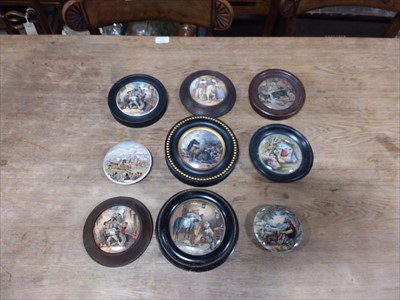 Lot 33 - A collection of Prattware pot lids, some framed