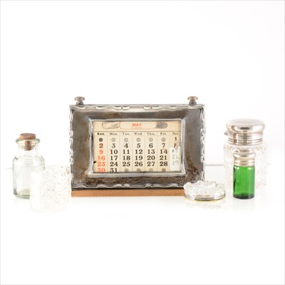Lot 167 - A silver mounted desk calendar, W J Myatt & Co, Birmingham 1928, plus glass dressing table jars.