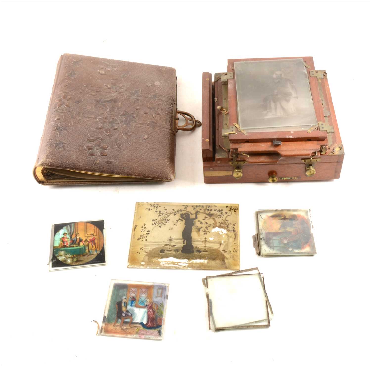 Lot 190 - A mahogany half-plate camera, a small collection of lantern slides; etc