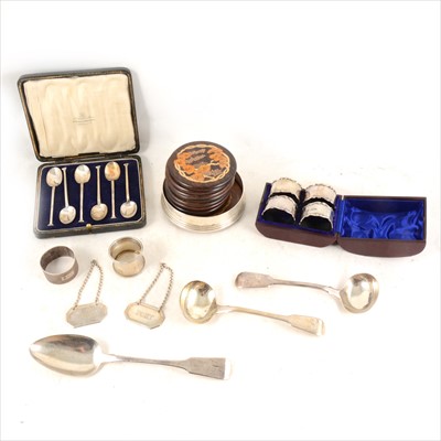 Lot 286 - A pair of Georgian silver serving spoons, maker's mark rubbed, London 1820, plus later flatware and napkin rings.