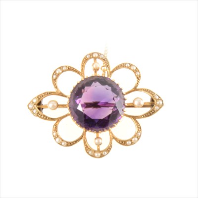 Lot 305 - An amethyst and seed pearl brooch.