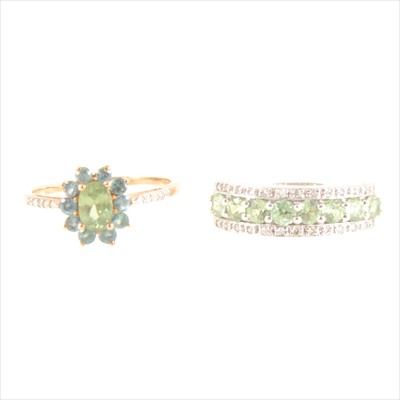 Lot 196 - A green stone half hoop ring and similar oval cluster ring.