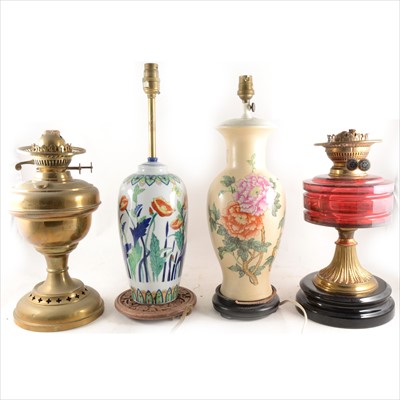 Lot 133 - A collection of six oil lamps