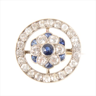 Lot 304 - A sapphire and diamond brooch.