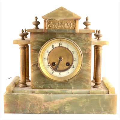 Lot 143 - A French onyx and gilt metal mantel clock