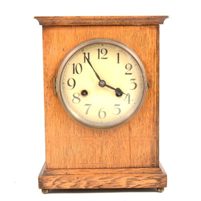 Lot 1423 - An Edwardian oak mantel clock