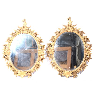 Lot 381 - Pair of oval gilt composition framed wall mirrors