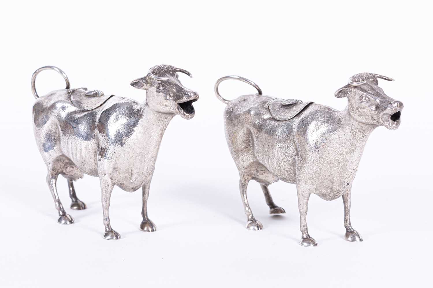 Lot 262 - Two similar Victorian silver cow creamers, lacking maker's mark, London, one dated 1884