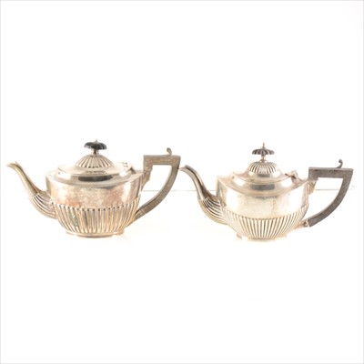 Lot 254 - Two silver bachelor teapots.