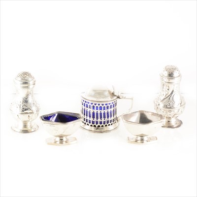 Lot 252 - Two silver pepper pots, a pierced drum mustard, and pair of hexagonal salts.