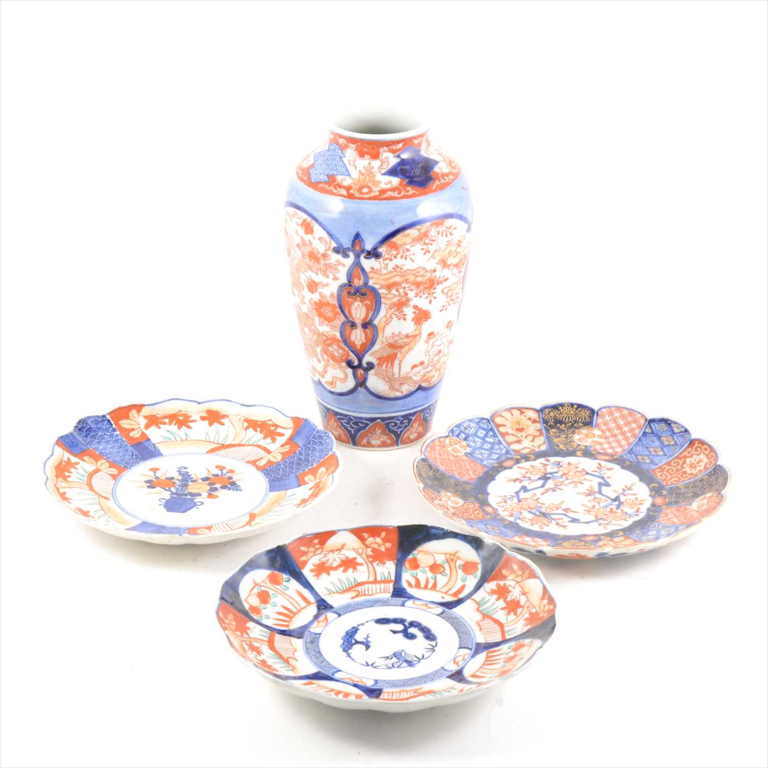 Lot 58 - Seven Japanese Imari ware plates, vase and a cup and saucer.