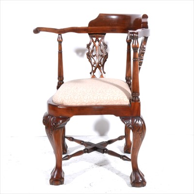 Lot 487 - A reproduction hardwood corner chair