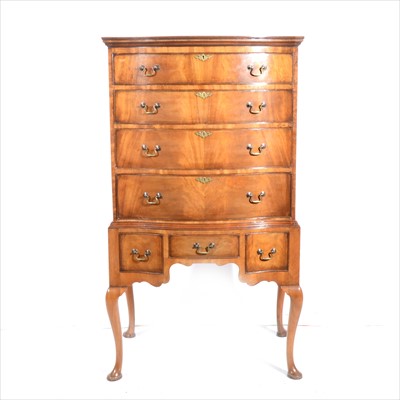 Lot 474 - A reproduction mahogany finish serpentine chest on stand