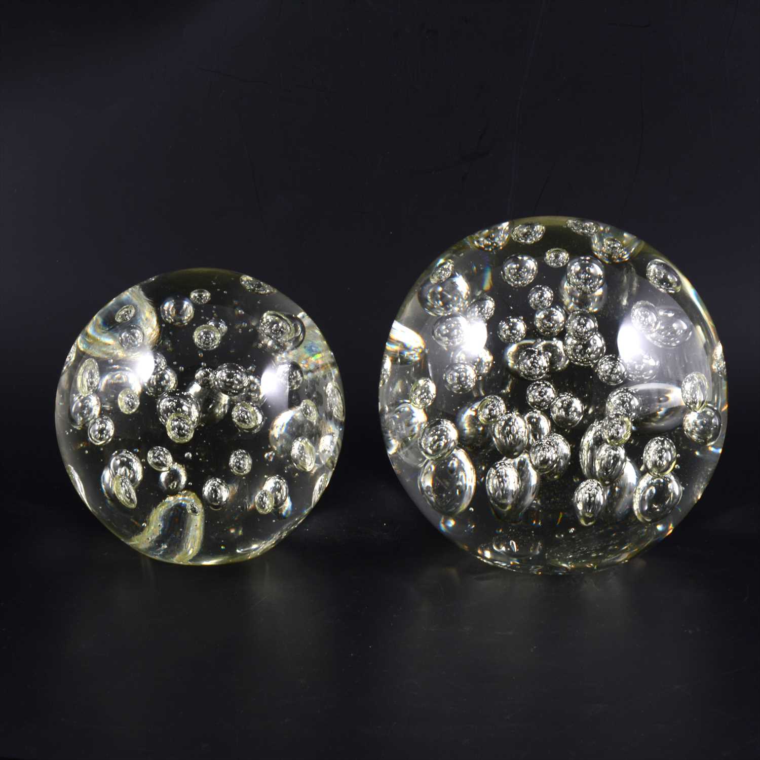 Lot 30 - A large glass dumpy 'paperweight', and another similar
