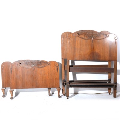 Lot 283 - A pair of walnut veneered single bedsteads