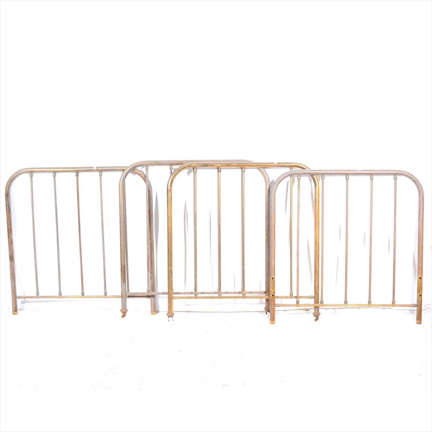 Lot 330 - A pair of oxidized brass single bedsteads, and another