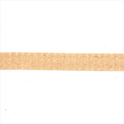 Lot 226 - A 9 carat yellow gold flexible five row brick design bracelet