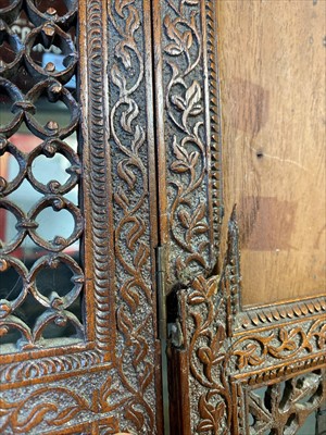 Lot 117 - Two mahogany wall brackets and a folding Indian carved photograph frame.