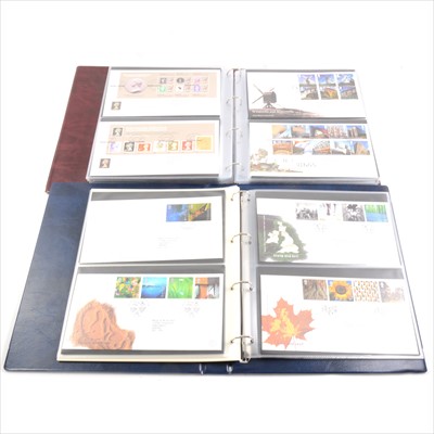 Lot 128 - Eight burgundy albums of "Royal Mail First Day Covers" 1980's -2000's