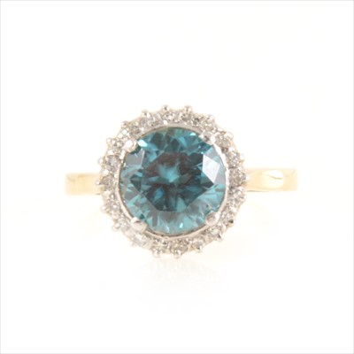 Lot 194 - A heat treated blue zircon and diamond cluster ring.